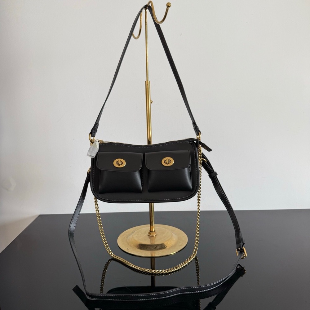 Coach Black Leather Shoulder Bag with Dual Front Pockets and Gold Hardware